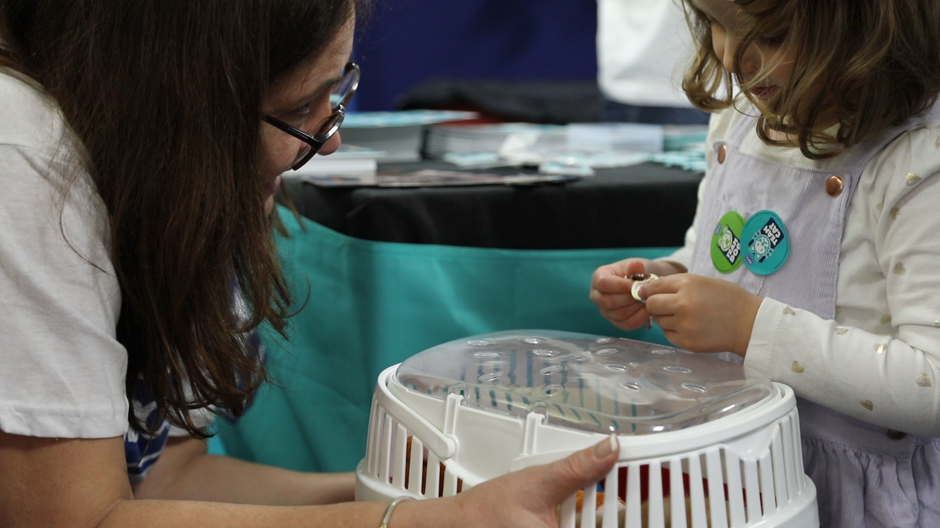 Exhibitor and child with an animal