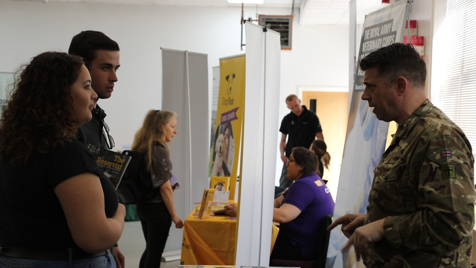 Visitors at Careers With Animals Day speaking to an exhibitor